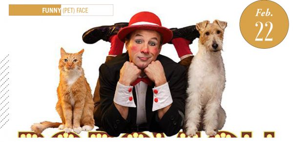 Gregory Popovich, dressed in clown face, with a cat on the left and a dog on the right