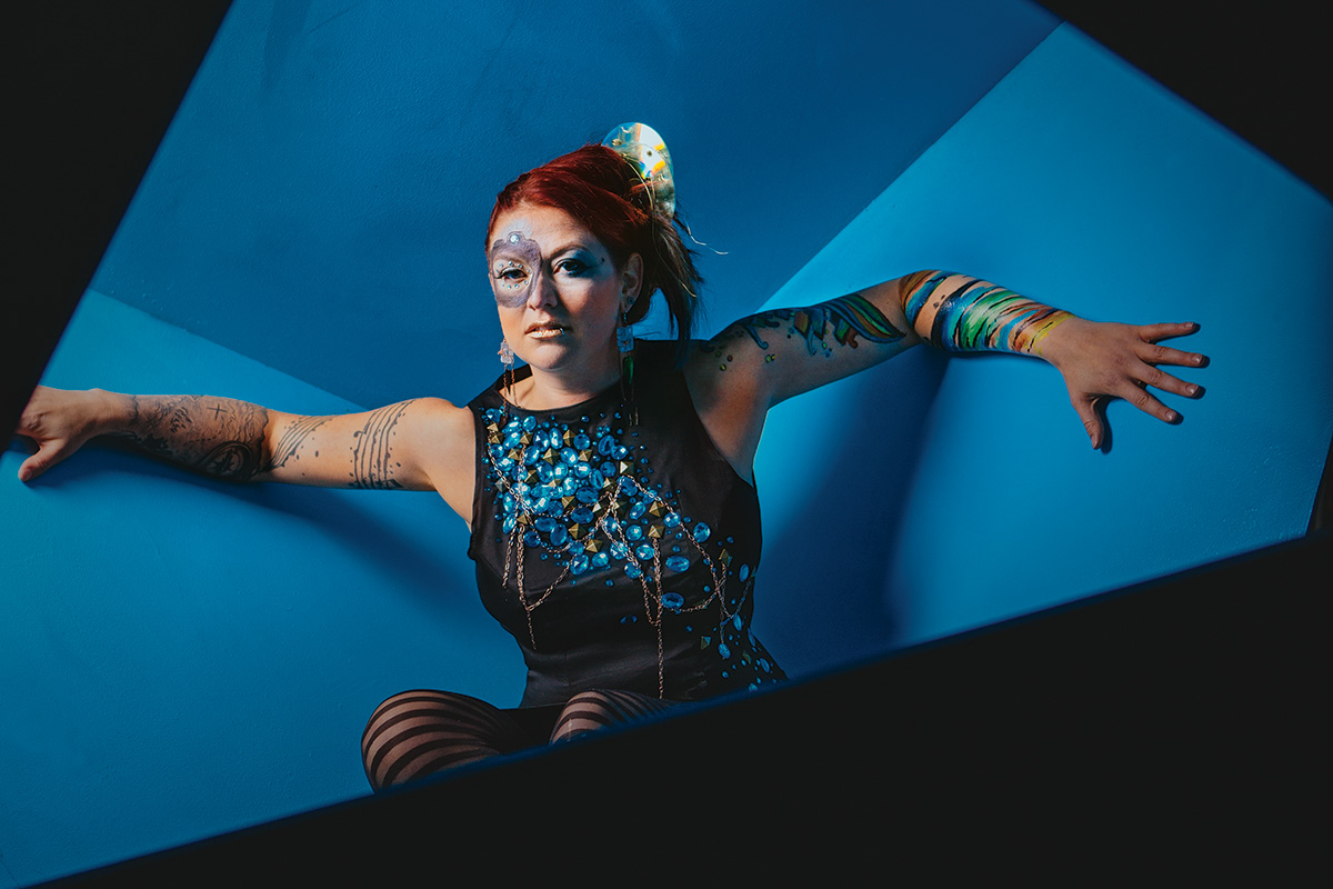 Amber Keller’s look is thanks to a few RAW:Omaha artists: Her dress is by Haus of Donna Faye, her earrings by Juan Mora-Amaral, makeup by Lyndee Marie, bodypaint by Alyssa Keller, and haircolor and style by Tammy Cox.