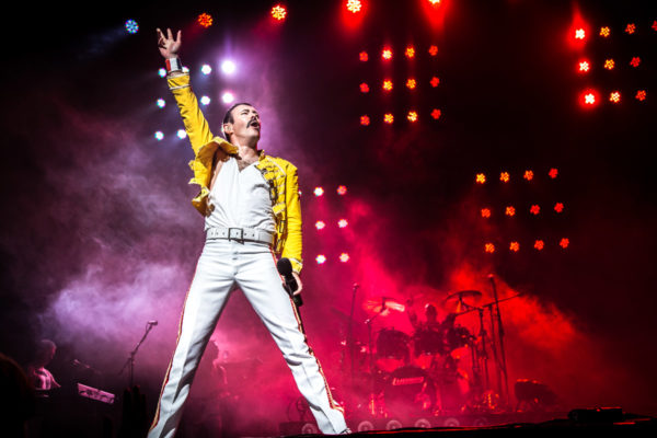 performer as Freddie Mercury onstage