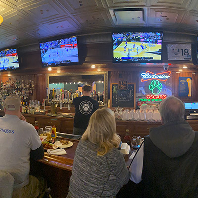 People watching March Madness Oscars Pizza