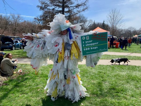 person covered in trash bags, Earth Day 