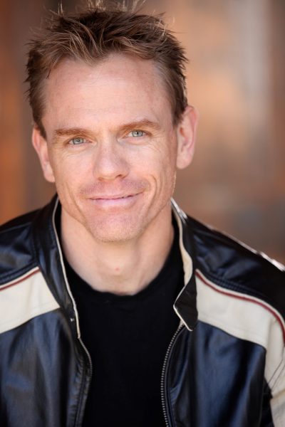 comedian Christopher Titus in leather jacket, head shot 
