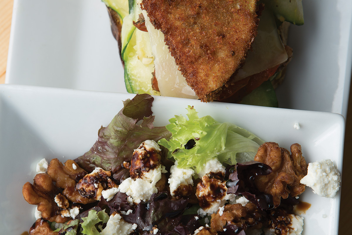 The open-face veggie sandwich pairs well with a salad of candied walnuts, feta, and balsamic reduction dressing. 