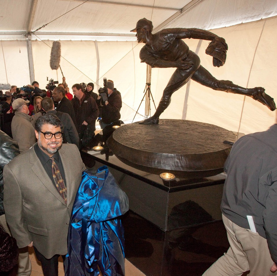Alston with his statue at the unveiling. Photo by Dave Jenkins.